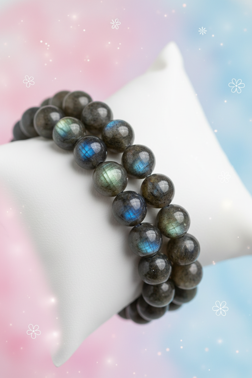 Beaded bracelet with labradorite stones on a mannequin arm against a pastel gradient background