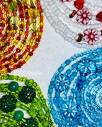Close-up of colorful beaded waists on a white background