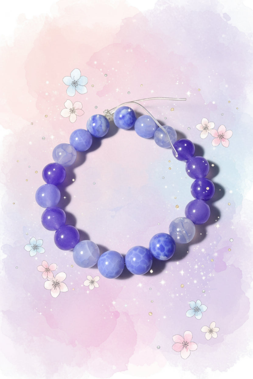 Blue beaded bracelet on a white background