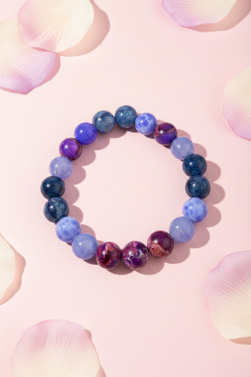 Beaded bracelet with blue and purple beads on a white background