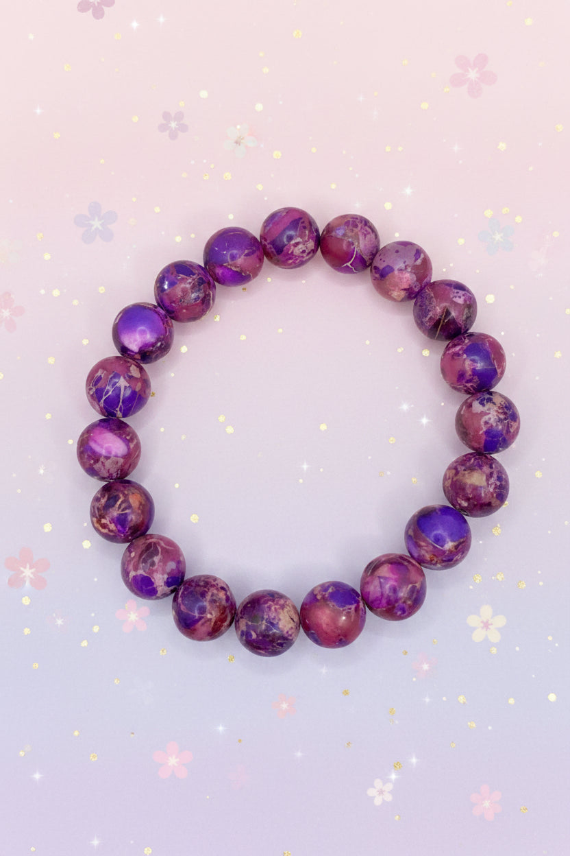 Purple marbled bead bracelet on a marble surface