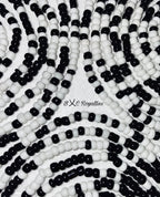 Close-up of black and white beaded pattern with 'BXC Royalties' branding.