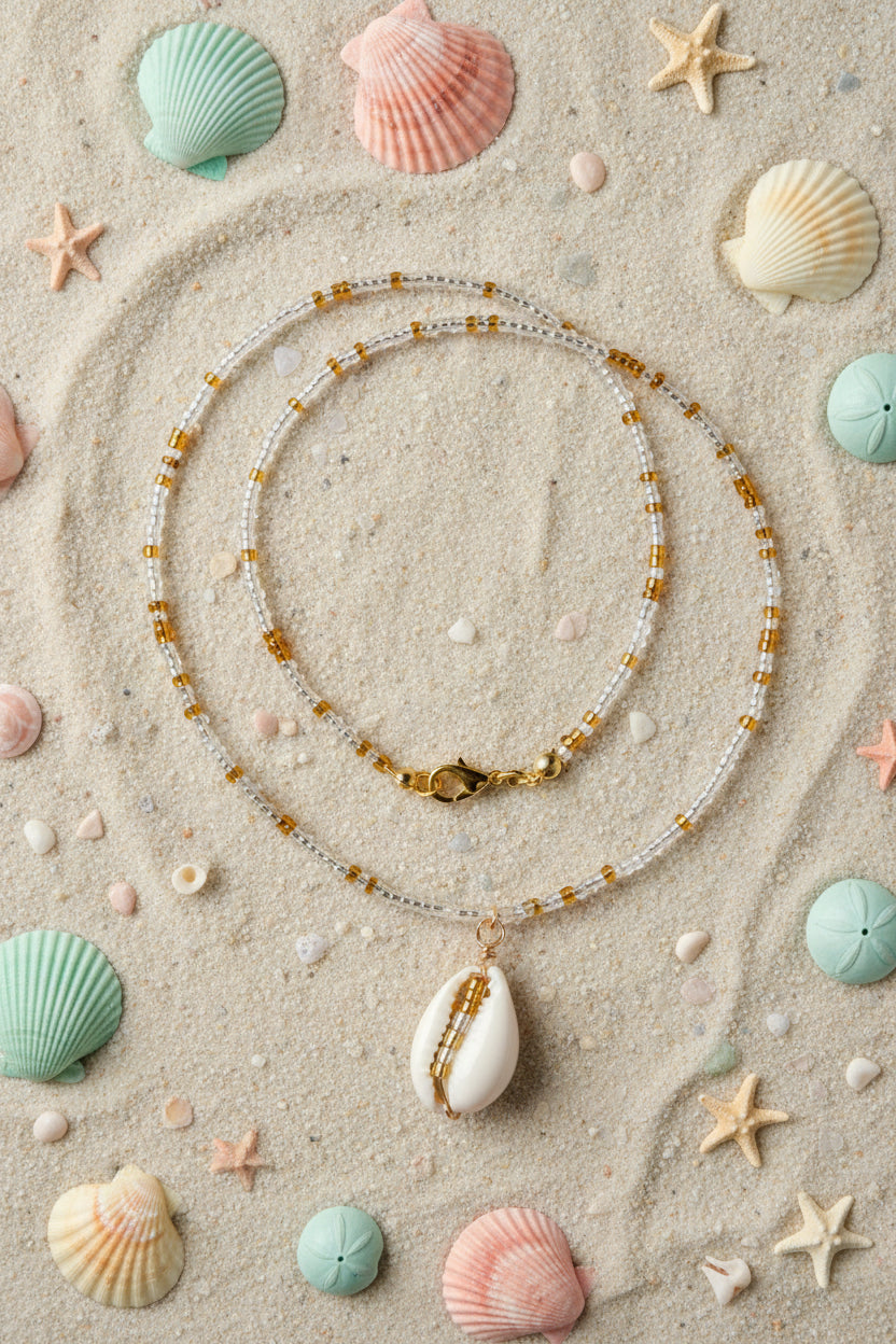 Necklace with shell pendant on a marble surface