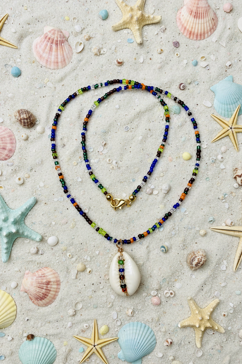 Necklace with a white pendant on a marble surface