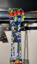 Colorful beaded waist-bead extensions on a metal rod with a blurred background.