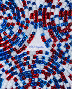 Close-up of red, white, and blue beads arranged in a pattern with 'BXC Royalties' branding.