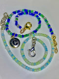Two beaded lanyards with charms for couples on a white background