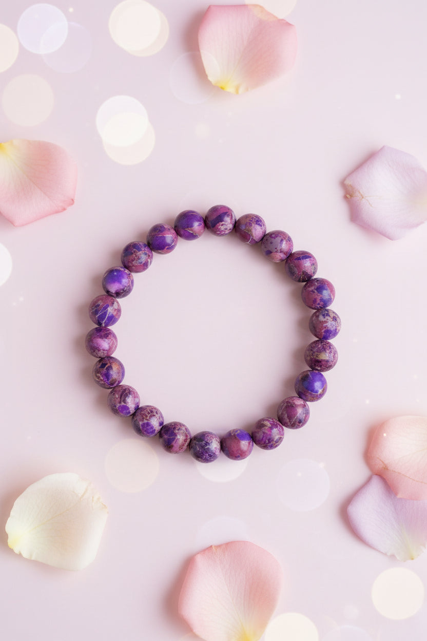 Purple marbled bead bracelet on a marble surface