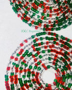 Close-up of red, green, and clear beaded strands on a white background with 'BXC Royalties' branding.